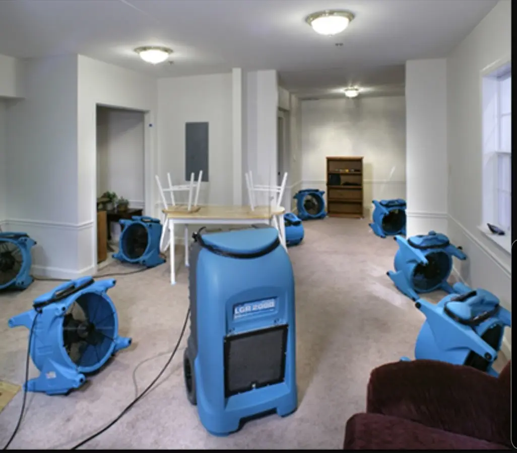 Air movers and dehumidifier setup for Water Damage Restoration in Riga